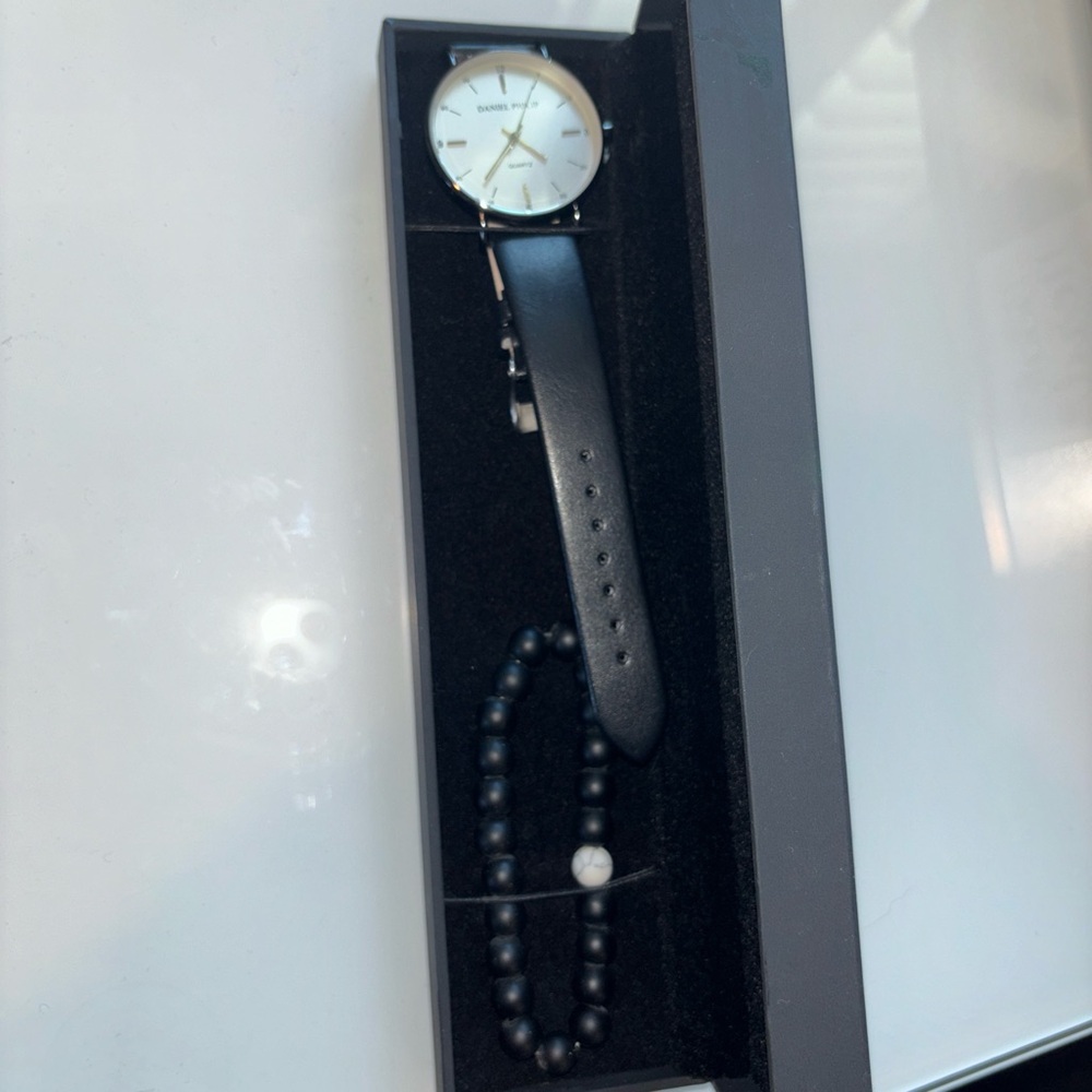 Daniel Phillip black classic watch with black bracelet